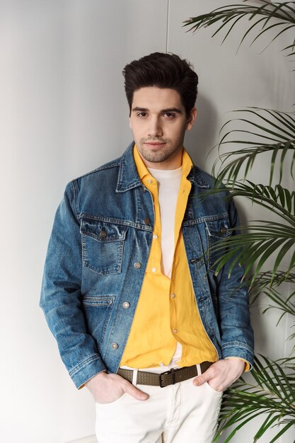 handsome young business man posing in cafe indoors.