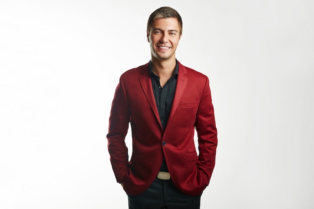 Handsome young business man in red suit