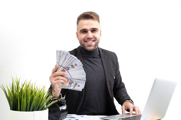 Handsome young businessman holding money