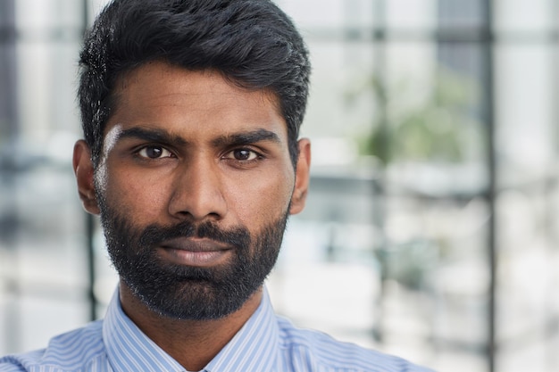 Handsome young businessman with a beard Vertical shot