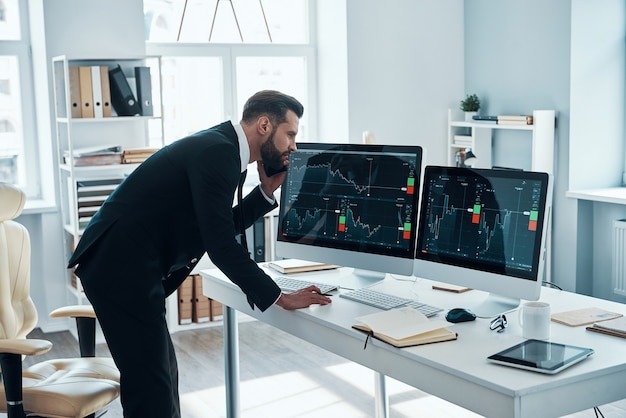 Handsome young businessman working on the desk