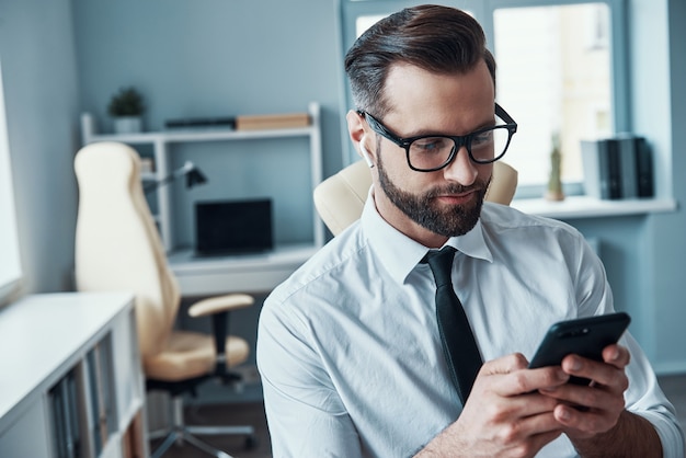 Handsome young businessman working on the desk