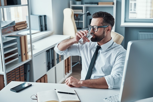 Handsome young businessman working on the desk