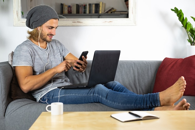 Handsome young caucasian man working at home