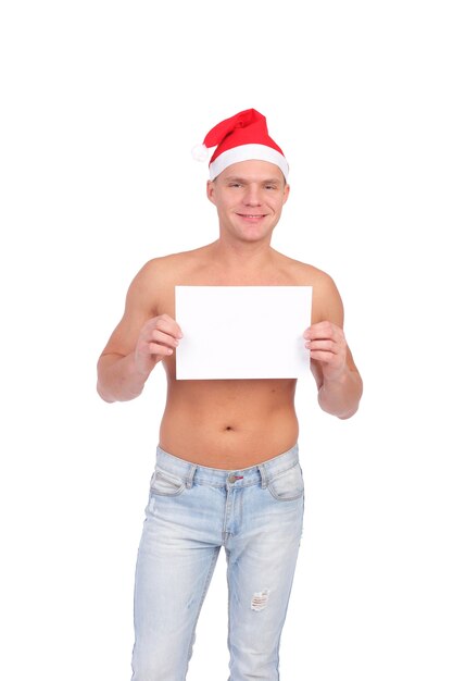 Handsome young Christmas guy with the blank sheet of paper