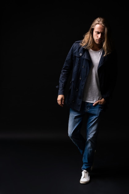 Handsome young and fit man posing in casual clothes, wearing jacket.