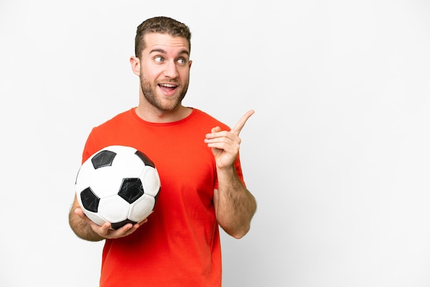 Handsome young football player man over isolated white background intending to realizes the solution while lifting a finger up