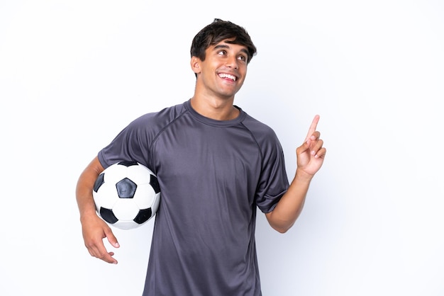 Handsome young football player man isolated on white background pointing up a great idea