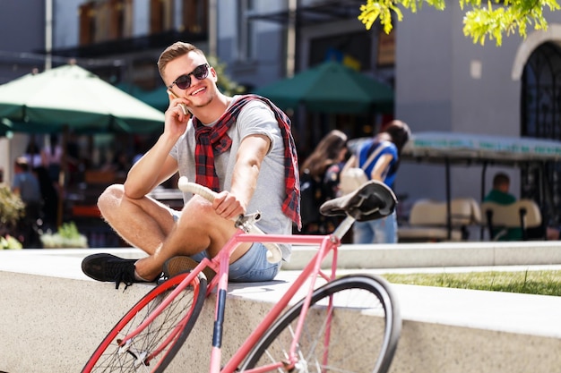 Handsome young hipster man in sunglasses