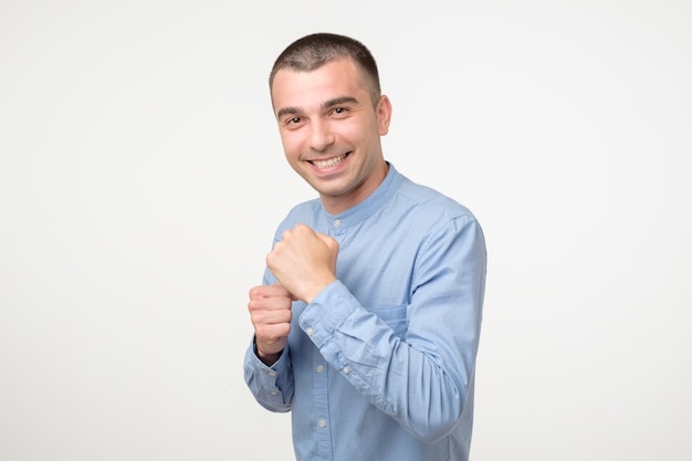 Handsome young hispanic man in fighting position