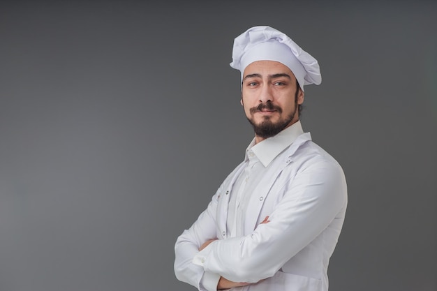 Handsome young Italian male chef portrait He is confident mood studio shot with copy space