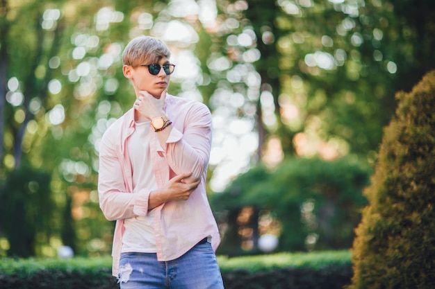 Handsome young man in the city park