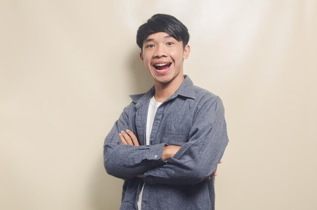 Handsome young man laughing over isolated background