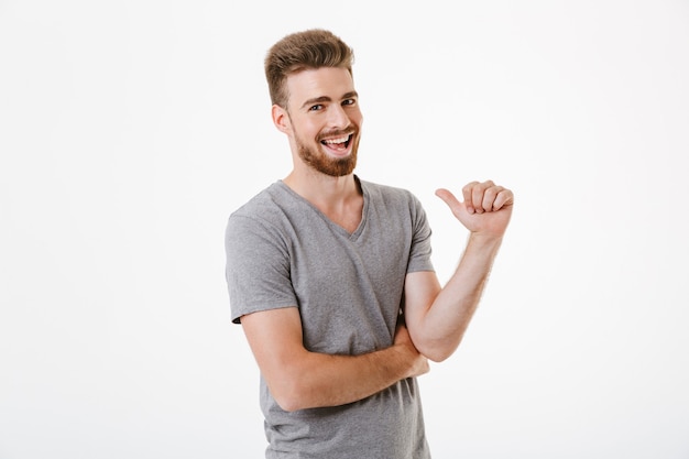 Handsome young man pointing to himself.