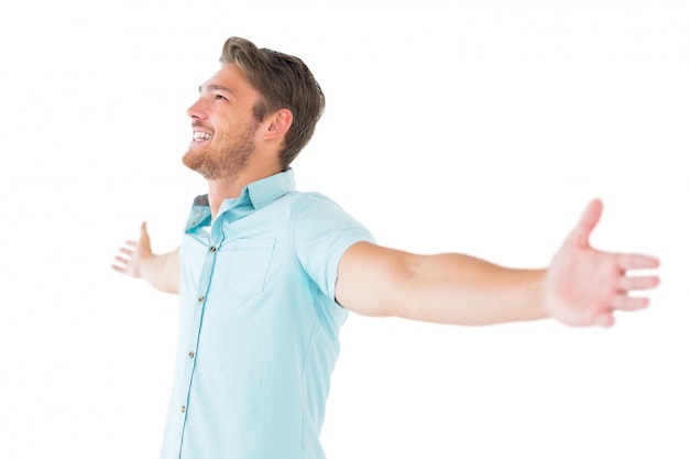 Handsome young man posing with arms out