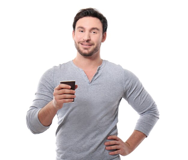 Handsome young man posing with cup