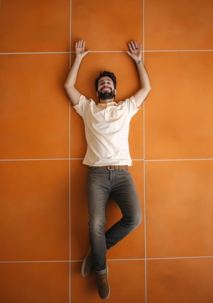 Handsome young man relaxing on orange tile wall Top view Generative AI