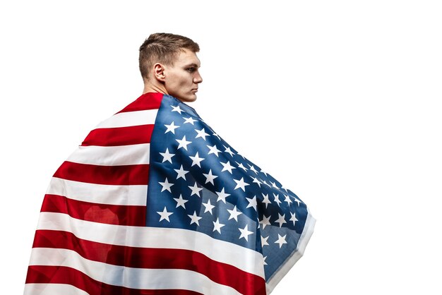 Handsome young man's torso covered with american flag.