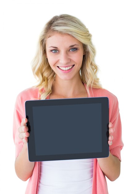 Handsome young man showing his tablet pc