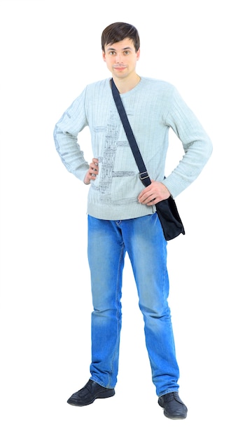 A handsome young man, showing his thumb up. Isolated on a white background.