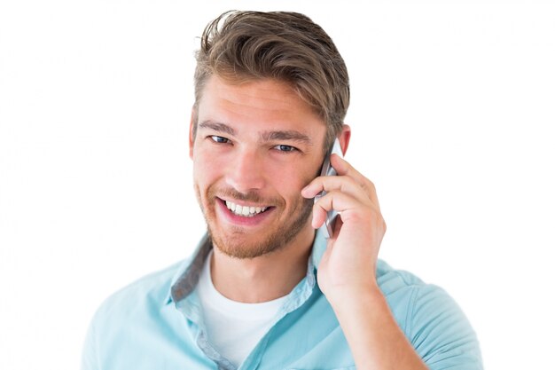 Photo handsome young man talking on his smartphone