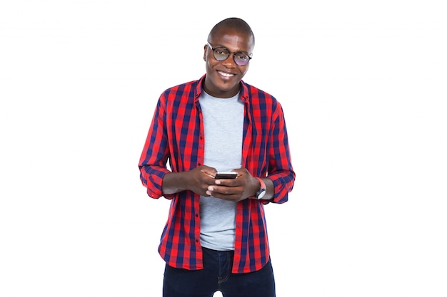 Handsome young man using his mobile phone. Isolated on white.