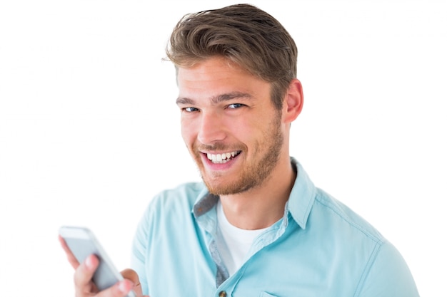 Handsome young man using his smartphone