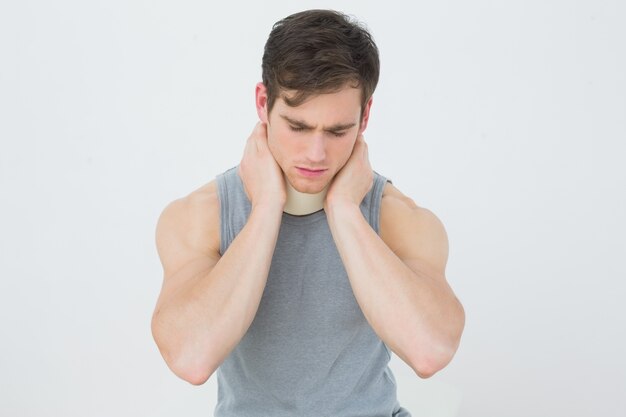 Handsome young man wearing cervical collar