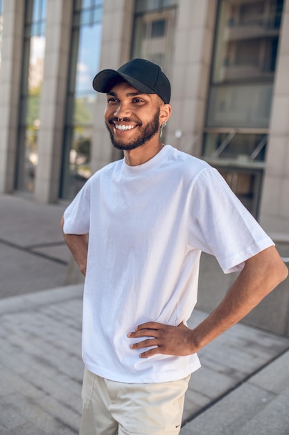 Handsome young man in white tshirt in the city center