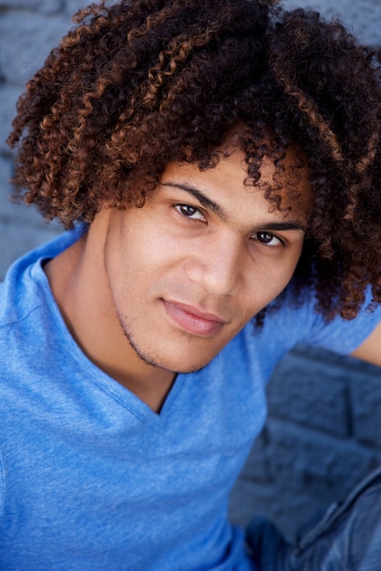 Handsome young man with curly hair