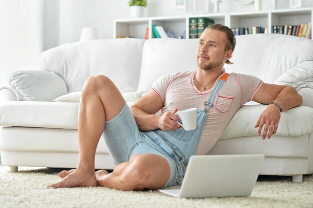 Handsome young man with laptop