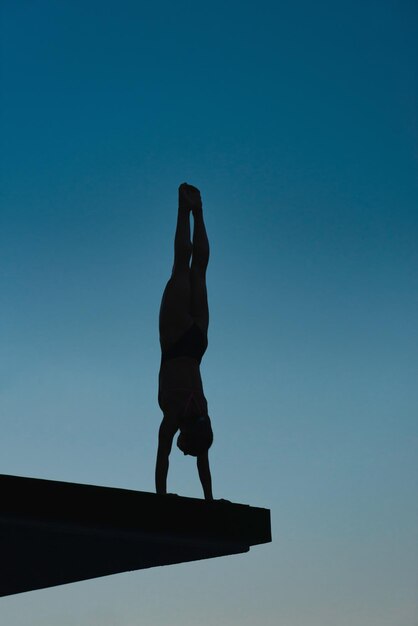 Handstand diver on board