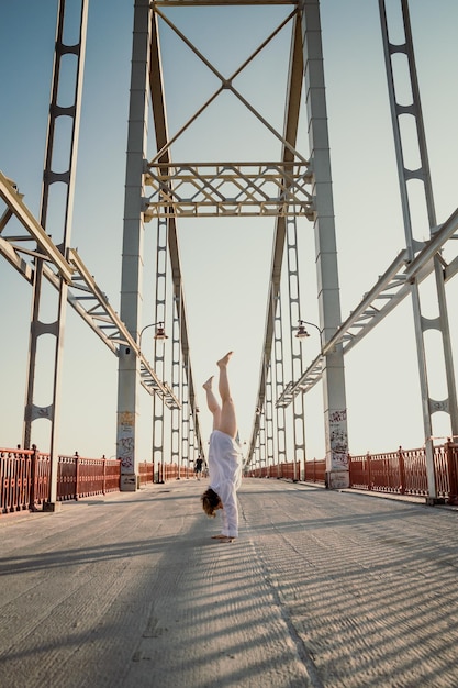 Handstand on pathway bridge scenic photography