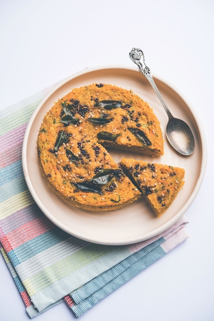 Handvo or handwa is a vegetable cake originating from the Gujarat, India. selective focus