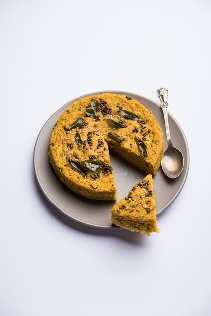 Handvo or handwa is a vegetable cake originating from the Gujarat, India. selective focus