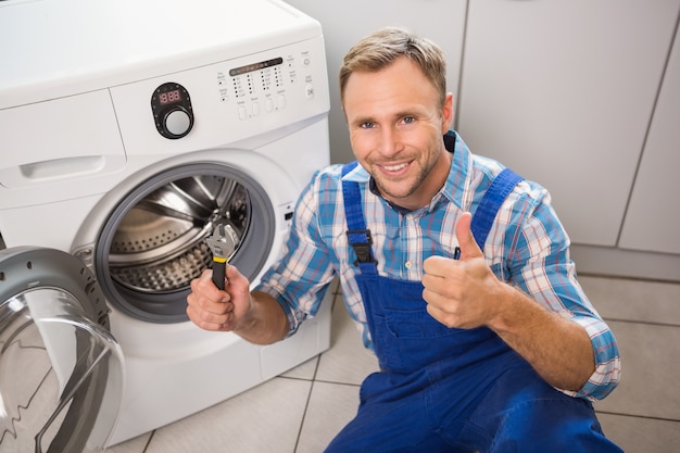 Handyman fixing a washing machine