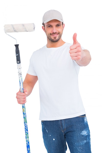 Handyman holding paint roller 