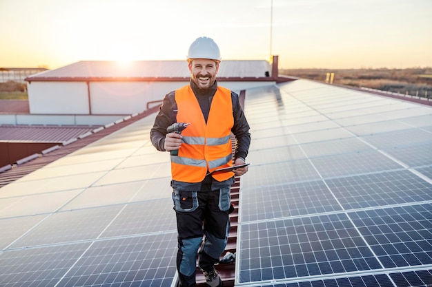 A handyman prepared for installation and testing solar panels