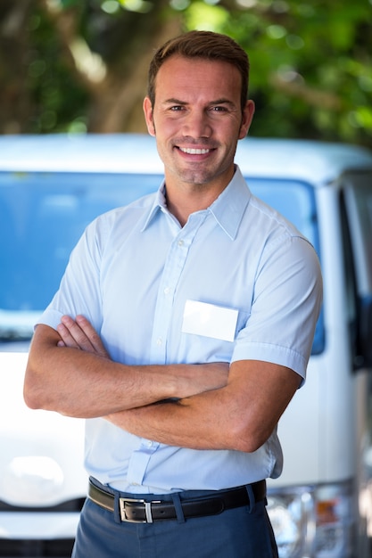 Handyman standing near his delivery van