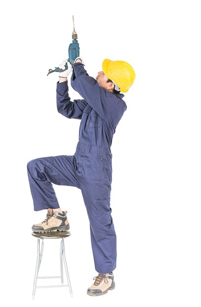 Handyman standing with his electric drill with clipping path