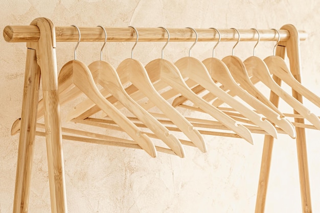 Photo hangers for clothes on wooden rack stand