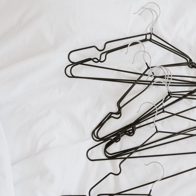 Hangers on white crumpled linen background