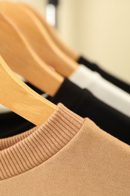 Hangers with stylish sweatshirts