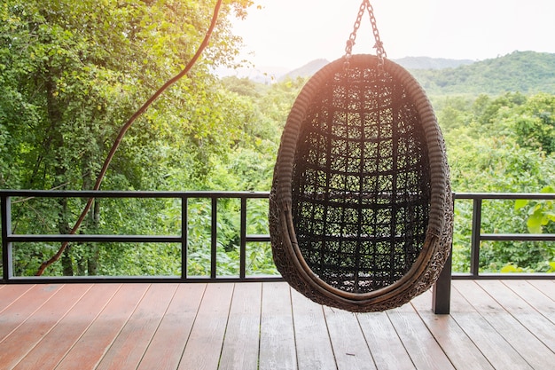 hanging chair in the balcony with nature view.