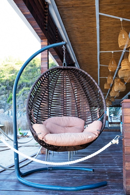 A hanging chair with a cushion that says'i love you '