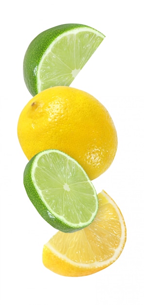 Hanging, falling, flying piece of lime and lemon fruits isolated on white background with clipping path