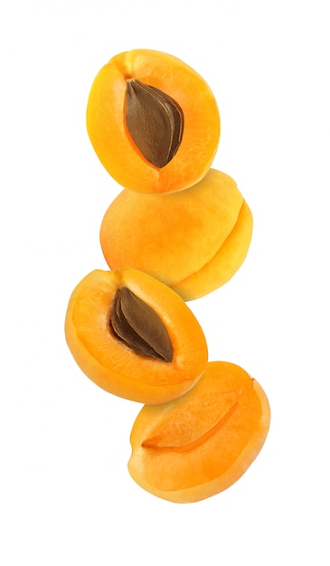 Hanging, falling, hovering and flying whole and sliced apricot isolated on white background with clipping path