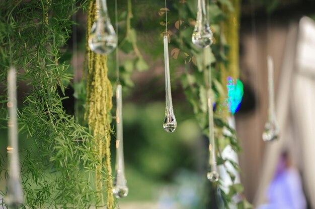 Hanging glass and shiny beads are an element of the wedding decor