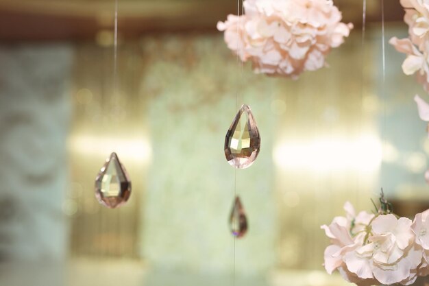 Hanging glass and shiny beads are an element of the wedding decor