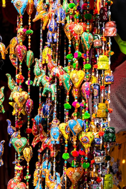 Hanging ornaments with Indian figures and colored charms to decorate interiors